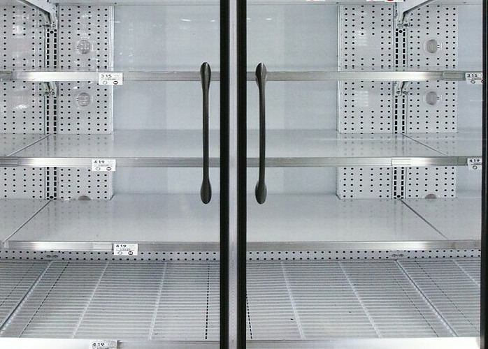 Empty cold fridge with clear glass doors